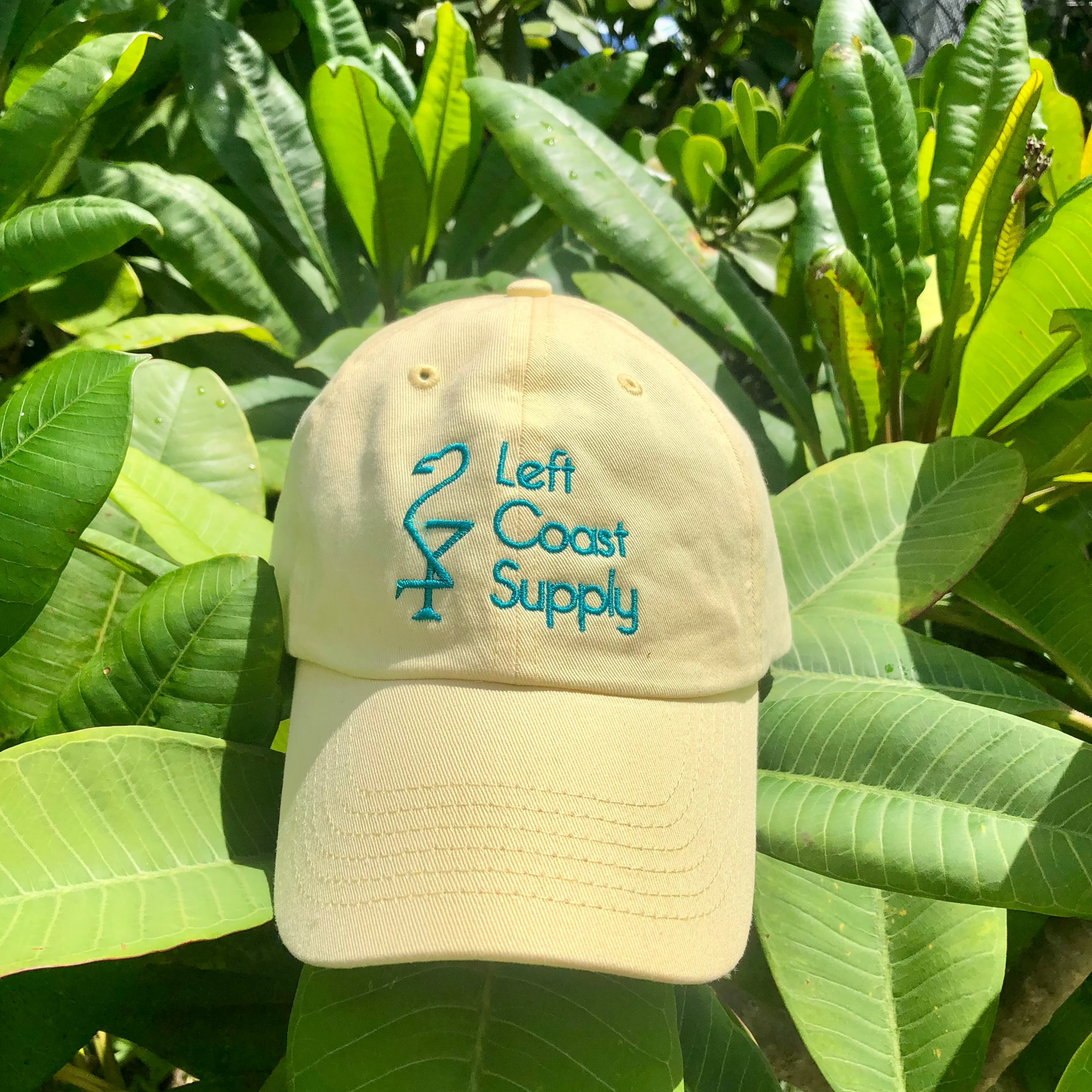 Yellow hat with Left Coast Supply logo.
