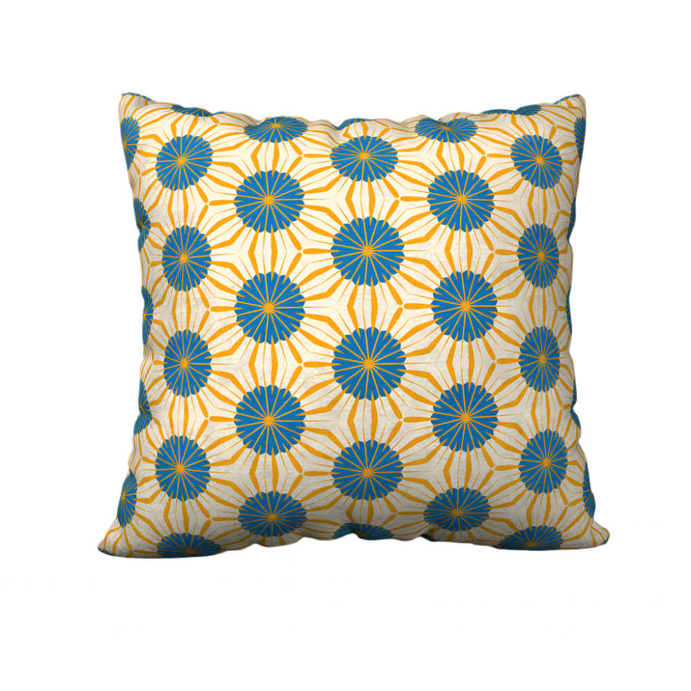 Orange pillow case with a vintage tiki print.
