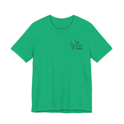 Green t-shirt with a navy outline of a flamingo wearing a Santa hat. Left Coast Supply