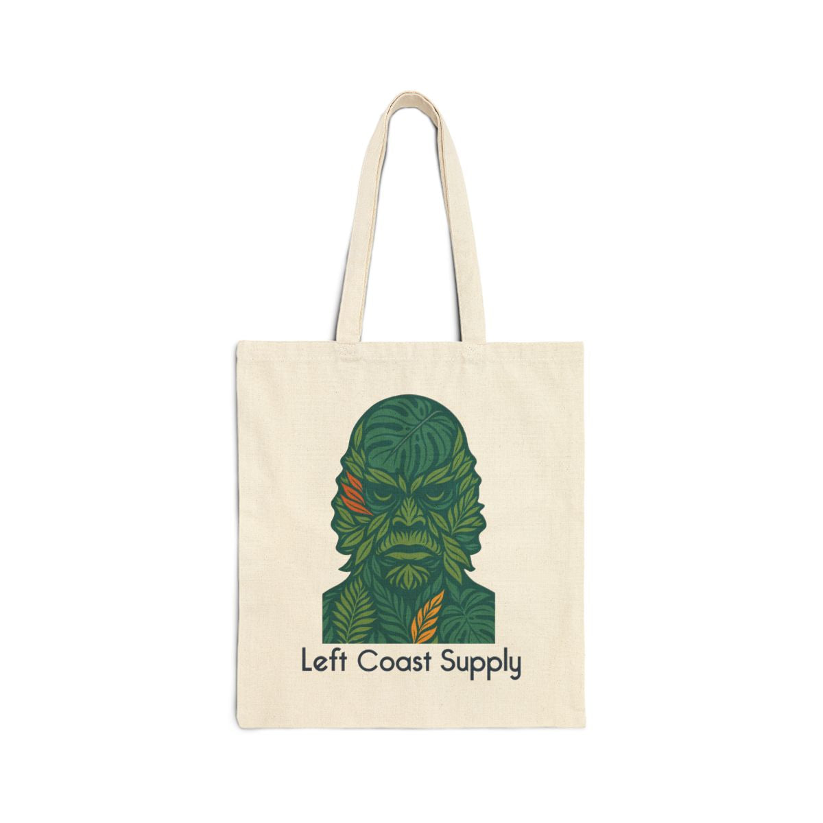 An off-white canvas tote bag with two handles, featuring a stylized green leaf-patterned character graphic and the text 'Left Coast Supply' printed on the front, set against a plain white background.