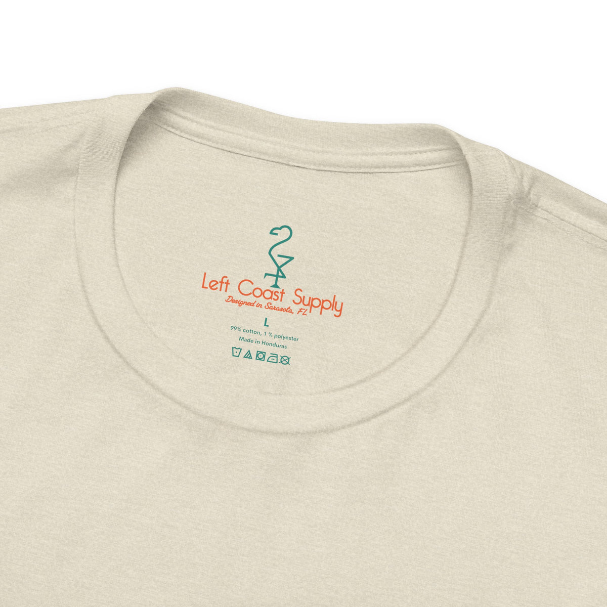 Beige t-shirt with a tropical Santa Claus graphic and 'Christmas Spirits'. Left Coast Supply