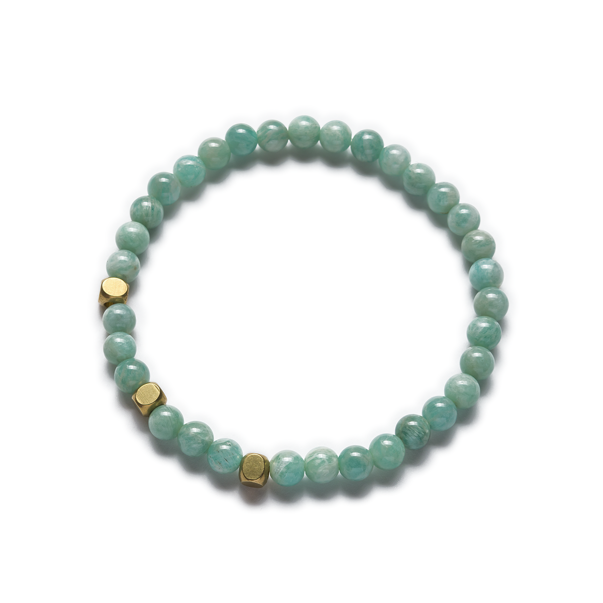 A stretch bracelet made with green amazonite beads and raw brass accents. Left Coast Supply