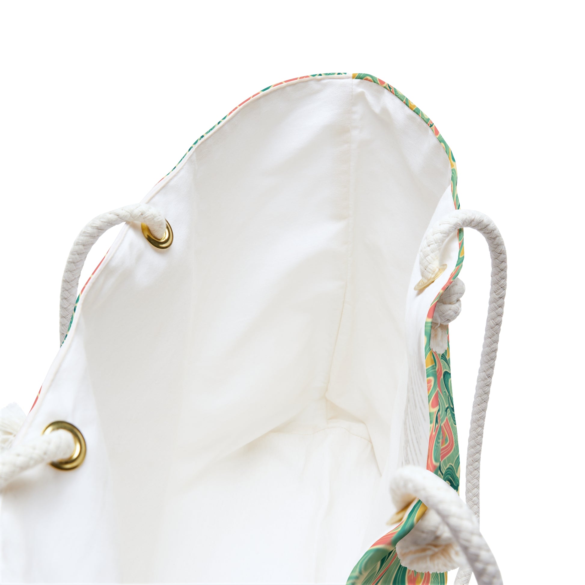 Beach tote with a watercolor pattern featuring mermaids and sunset hues, with white nautical rope handles. Left Coast Supply
