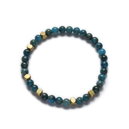 A stretch bracelet featuring round blue apatite beads and raw brass accents. Left Coast Supply