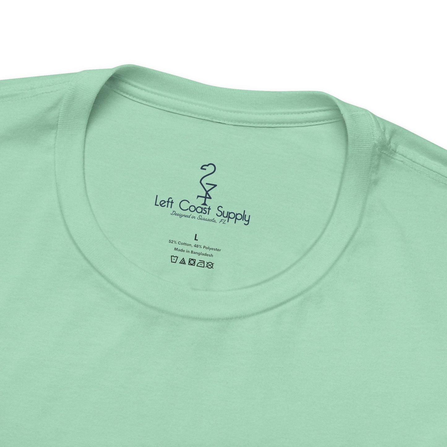 Light green t-shirt with a navy blue flamingo graphic on the back Left Coast Supply