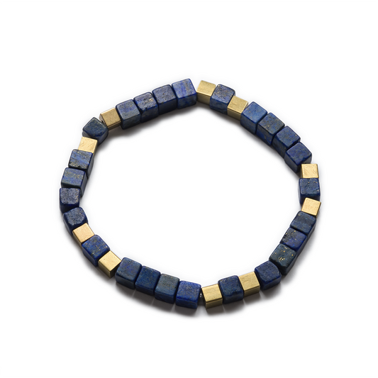 A stretch bracelet made of square-cut lapis lazuli beads and raw brass accents, with a no-fuss fit. Left Coast Supply