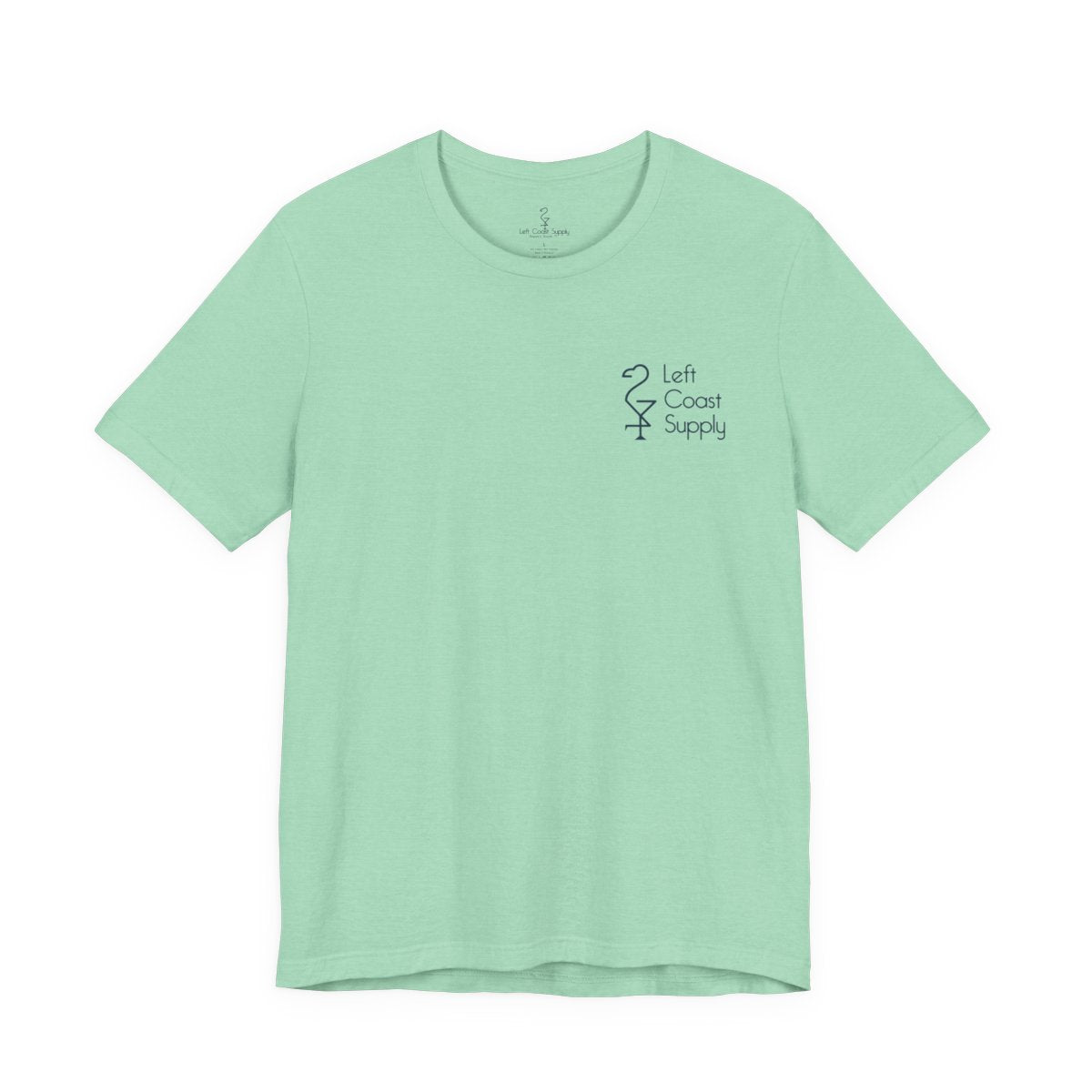 Light green t-shirt with a pink flamingo graphic and 'Left Coast Supply'
