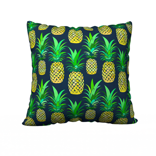 Throw pillow cover with a deep navy background featuring a colorful pineapple pattern in shades of green and yellow. Left Coast Supply