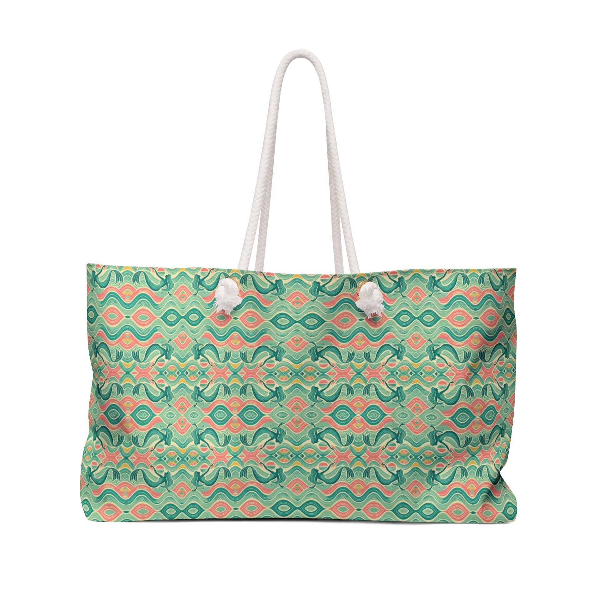 Beach tote with a watercolor pattern featuring mermaids and sunset hues, with white nautical rope handles. Left Coast Supply