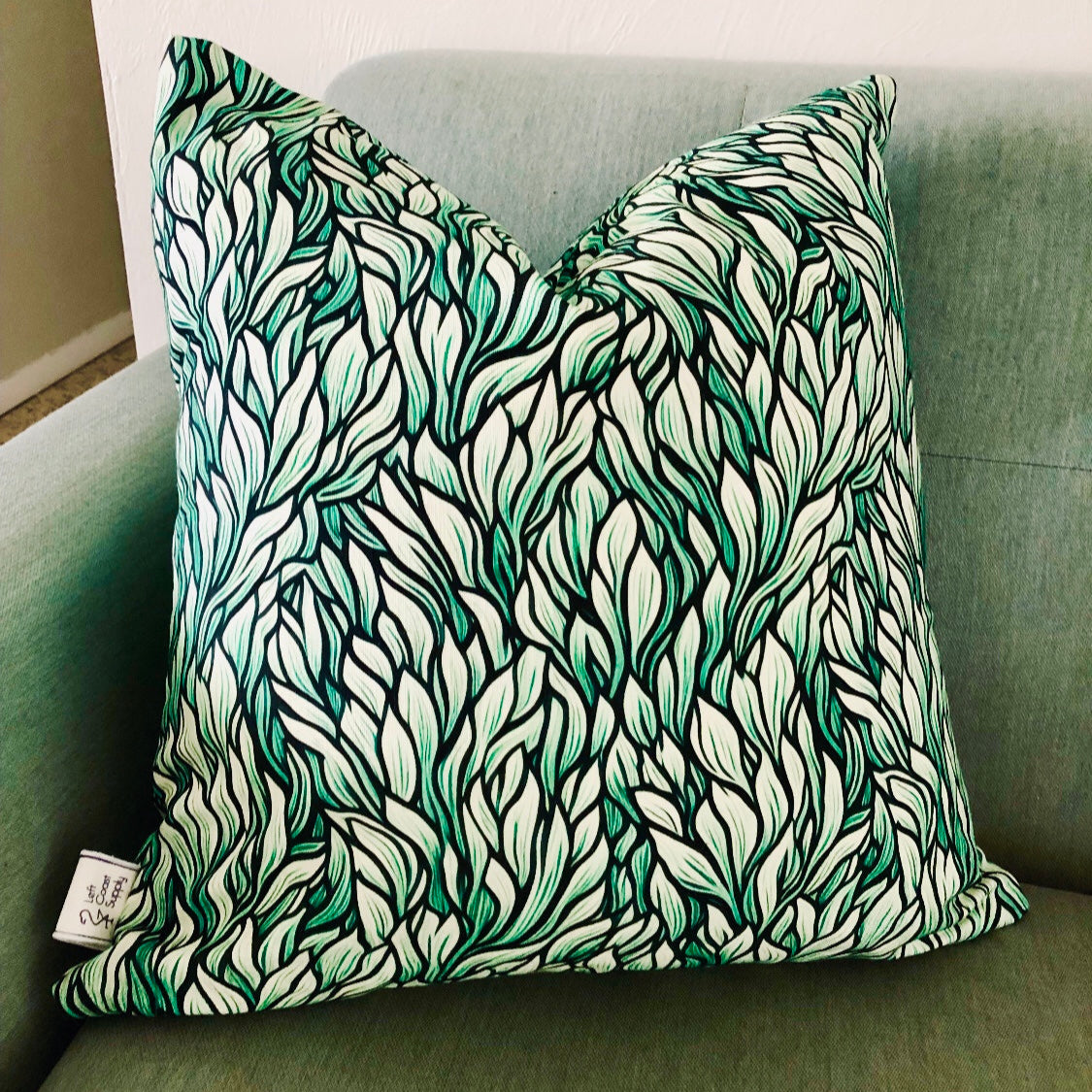 Throw pillow cover with a green seaweed pattern. Left Coast Supply