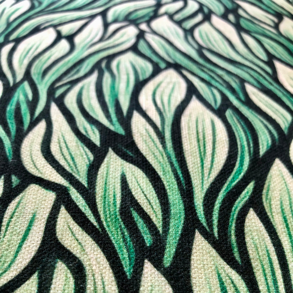 Throw pillow cover with a green seaweed pattern. Left Coast Supply