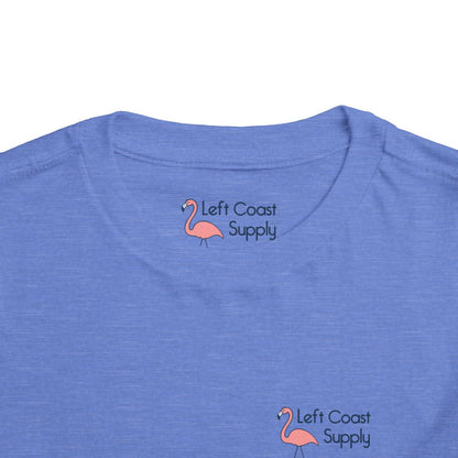Blue toddler t-shirt with a pink flamingo graphic and 'Left Coast Supply' 