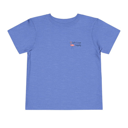 Blue toddler t-shirt with a pink flamingo graphic and 'Left Coast Supply' 